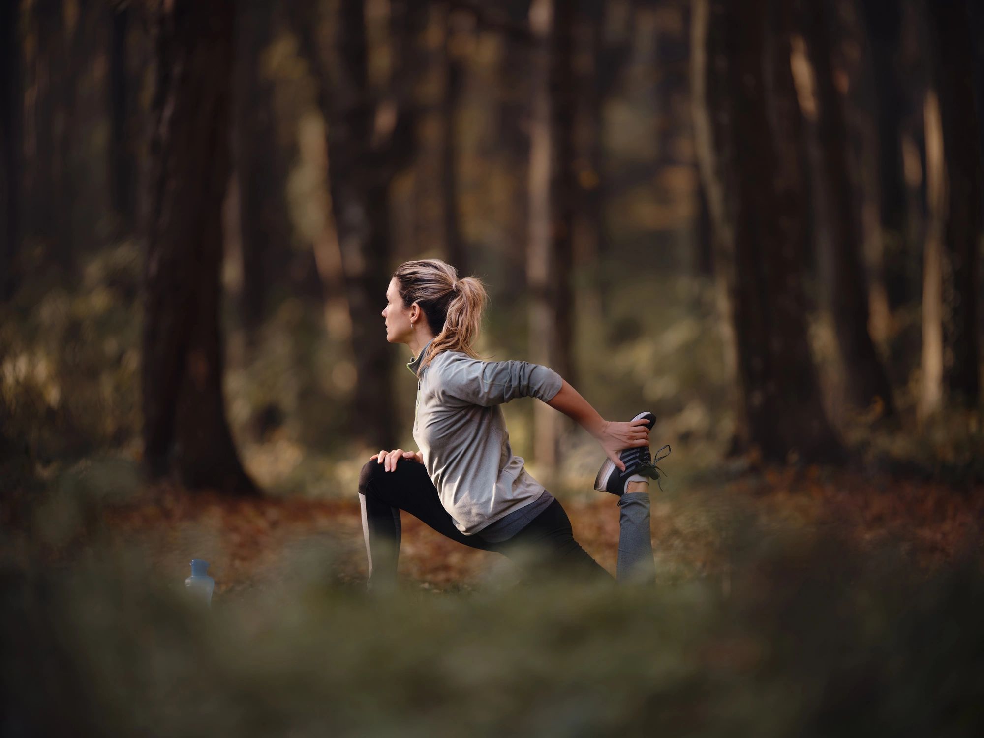 Athlete stretching outdoors during training